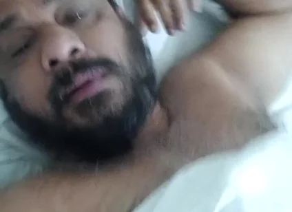 Indian Daddy Lying on the Bed Teasing and Posing for You