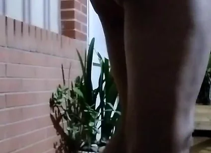 In the Doorway in a Thong and with an Anal Plug
