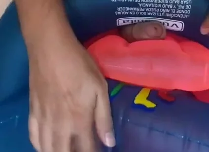 Playing with inflatable swim ring