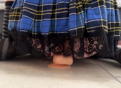 Riding a dildo in a miniskirt