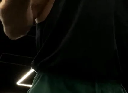 Doing a Biceps Curls with a Straight Barbell