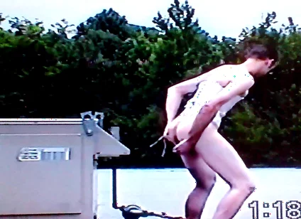 Crossdresser Riding a Giant Dildo on a Roof Top