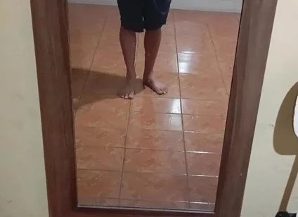 Boy in Shorts in the Mirror