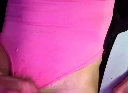 Crossdresser Michelle Wearing Pink Bodysuit While Playing with Cock
