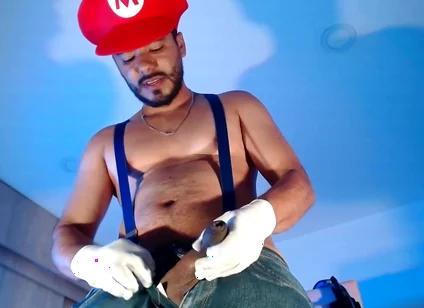 Dressed as Mario Bros Playing with His Plumbing Tool