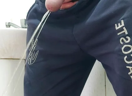 A Well-endowed Brazilian Man Urinating and Showing His Thick Penis to His Female Friends.