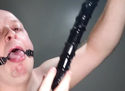 Deepthroating an 18 Inch Dildo with Mouth Gag Ring
