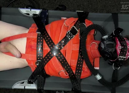 Bondage Twink Strapped to Campbed in Straitjacket and Gas Mask