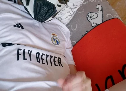 The Guy Is Wearing a Soccer Uniform and Mxhelmet with a Morning Cum