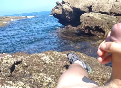 Jerking off a Big Hard Dick Overlooking the Sea in the Beach Cove Until He Cums