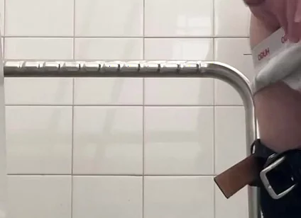 In the Hospital Toilets, a Guy Pisses Into a Cup for a Urine Sample, Then Gets Horny, Jerks-off and Cums