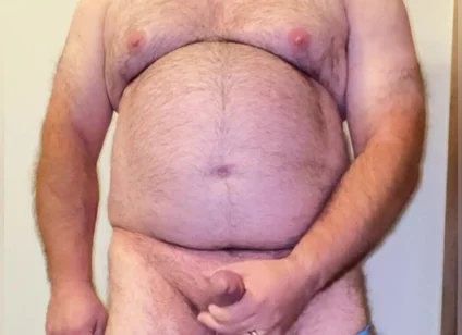 Anal Steve in His Blue Thong Showing off His Bear Body and Cock, with a Cock Ring on and Showing His Massive Butt Plug