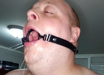 Deepthroating a 7 Inch Dildo with Mouth Gag Ring