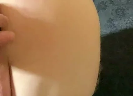 A Crossdresser in Leggings and a Seductive Bodysuit Plays with Ass