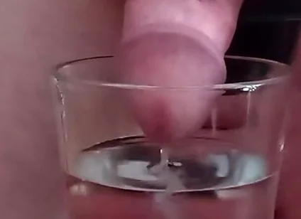 Cumming in a glass of hot water