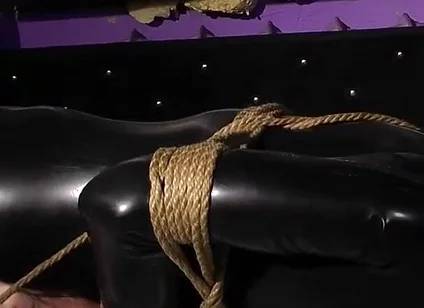 Roped in Latex: Zeus Struggles to Break Free