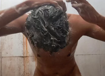 Exotic Skinned Adult Man Taking a Bath in the Afternoon