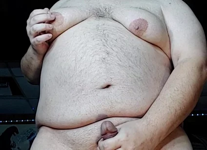Chubby Guy Stands and Cums