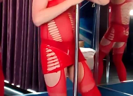 She Dances in a Red Bodysuit, as if Someone Is Going to Take Her Right at the Pylon