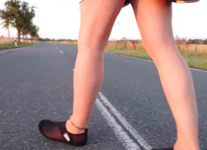 Bright Pantyhose and Beach Shoes in Puddle
