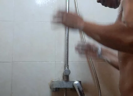 Exotic Skinned Asian Adult Man Taking a Shower in the Morning